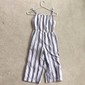 A blue and white kids jumper. It was worn once